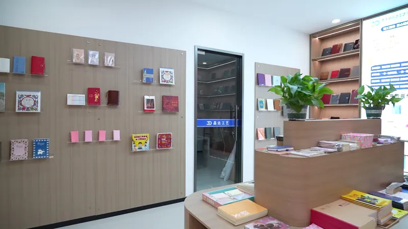 A showroom displaying notebook samples with different cover designs, colors and formats