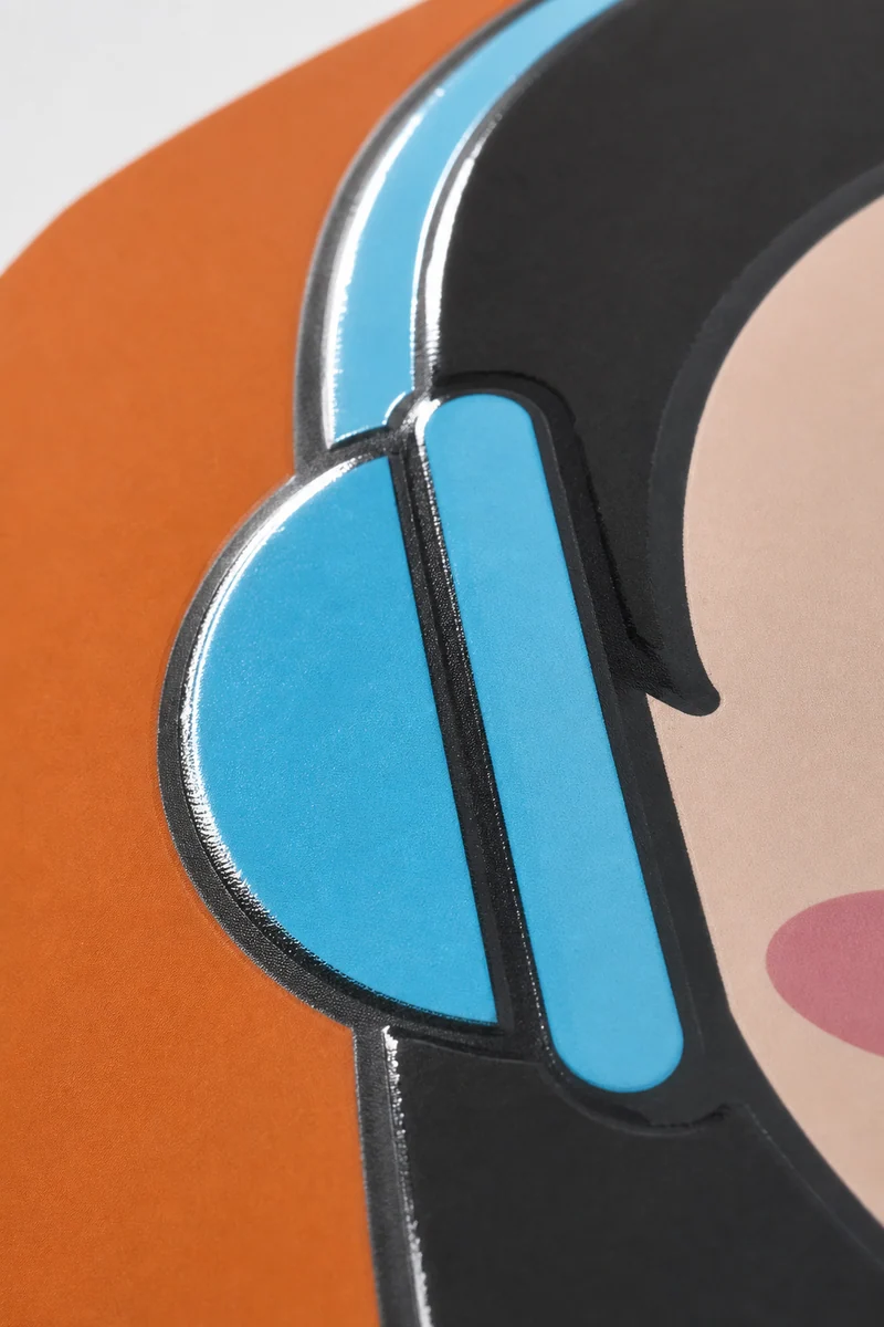 Macro close-up of spot UV gloss on a printed cover