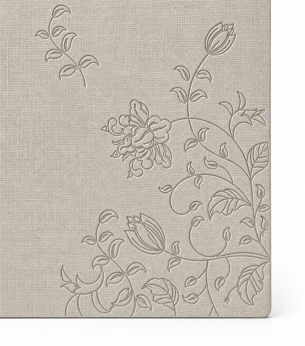 Macro close-up of a debossed floral pattern on a notebook cover