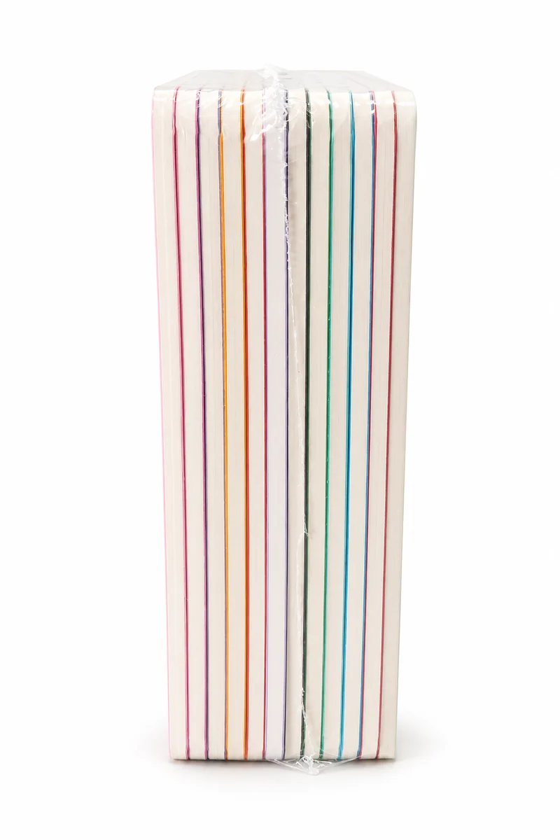 A shrink-wrapped bundle of notebooks seen from the side