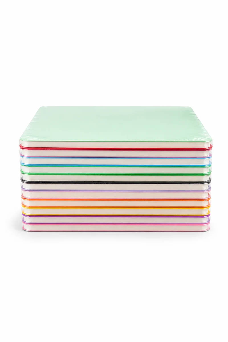 Shrink-wrapped notebooks stacked flat
